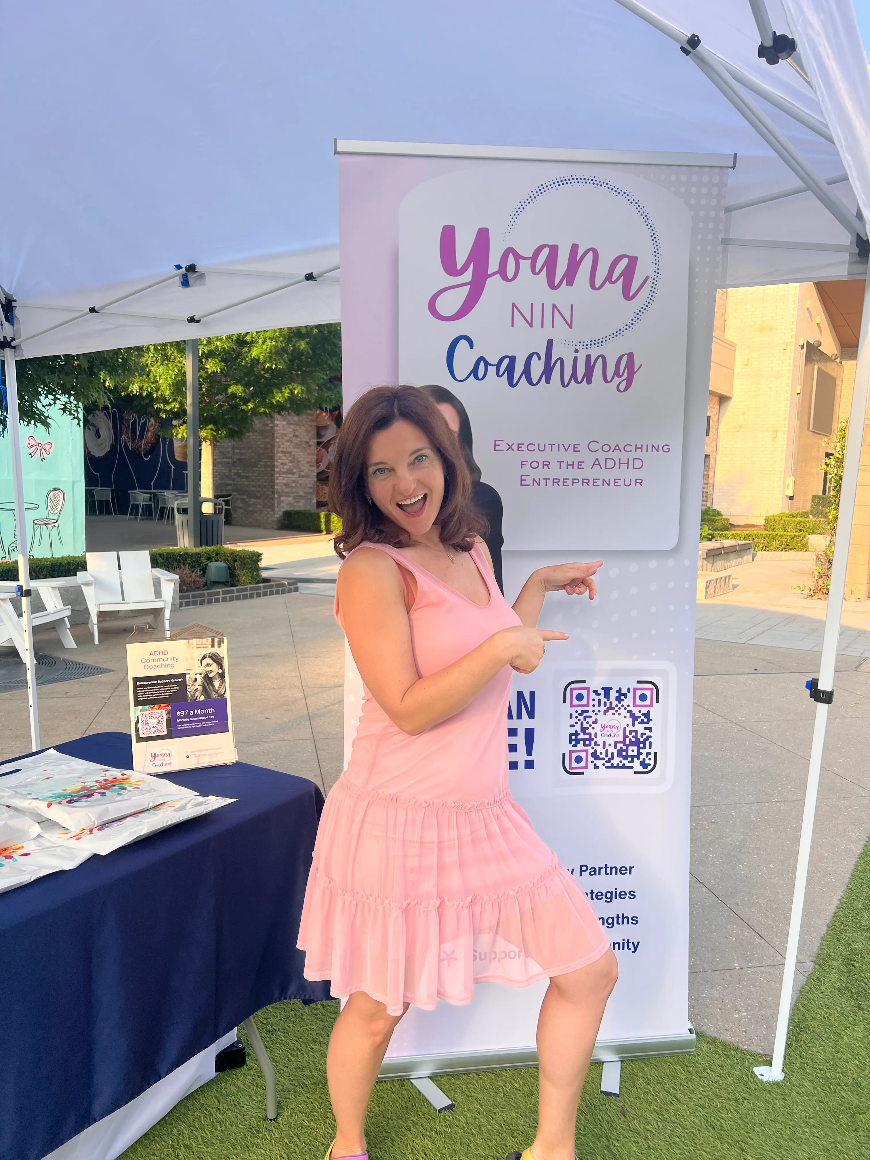 Yoana Nin posing by Relay for Life event sign